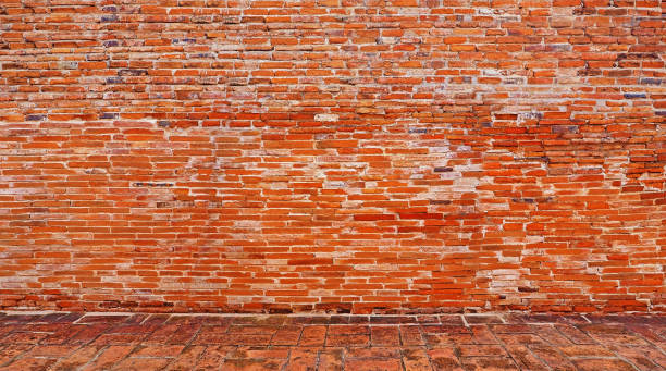 istock old Ancient brick background with ground brick stone floor tile 967553362