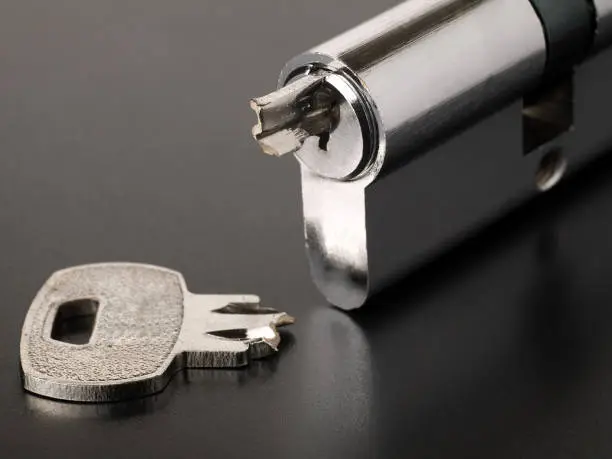 Photo of Pin tumbler of cylinder lock internal mechanism and broken key