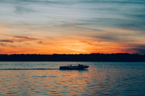 istock The river craft in the rays of sunset 967568628