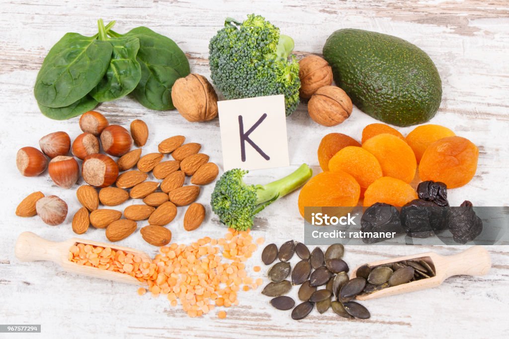 Fruits and vegetables containing vitamin K, minerals and dietary fiber, healthy nutrition concept Fresh fruits and vegetables containing vitamin K, dietary fiber and minerals, concept of healthy nutrition Vitamin Stock Photo