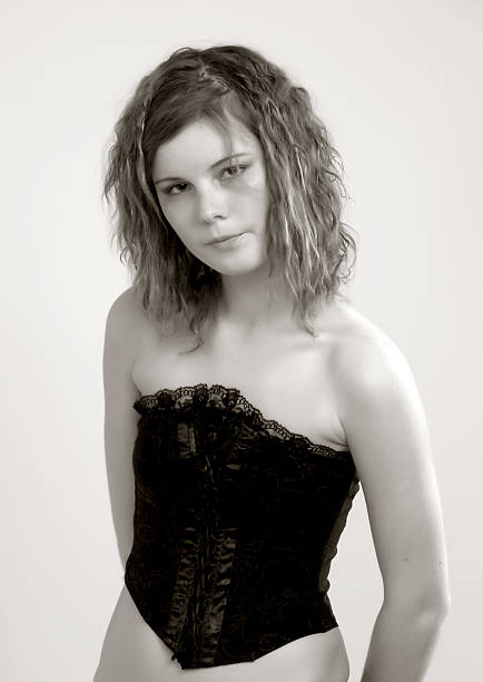 istock young woman in corset 96758845