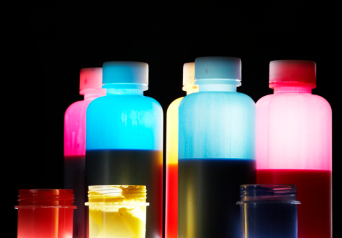 colorful liquid in plastic opaque bottles