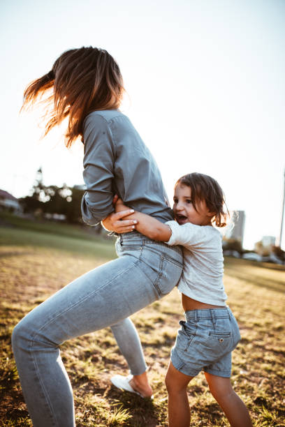 istock happy family have fun in the park 967603982