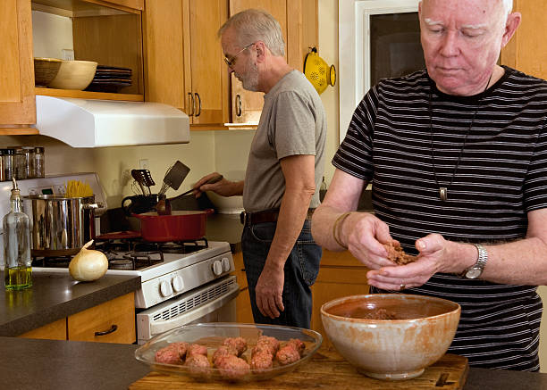 istock Mature gay couple cooking dinner 96760597