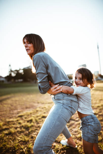 istock happy family have fun in the park 967606088