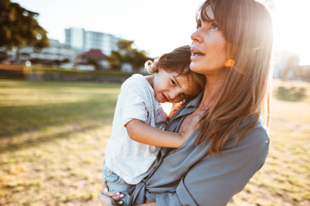 istock mom carrying a little kid 967606760