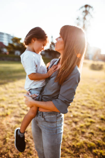 istock mom carrying a little kid 967607028