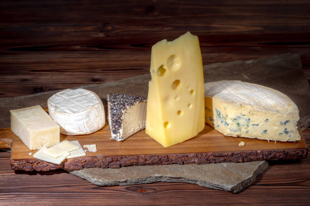 istock various types of cheeses on wooden background 967660544