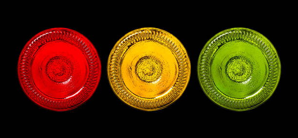 istock Three bottle bottoms as a traffic light isolatad on black background. 967664076