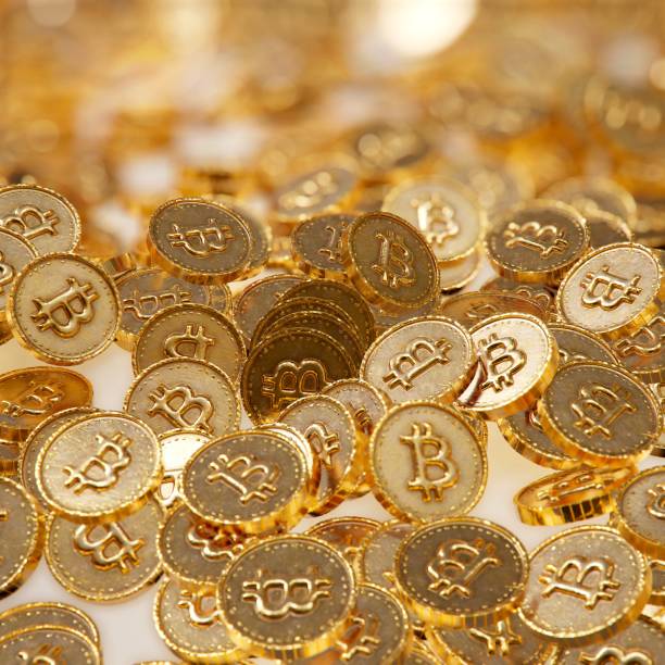 istock heap of gold coins with bitcoin sign. 967673076