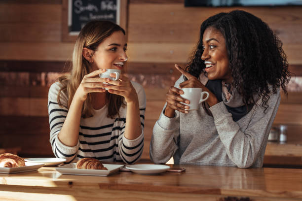 istock Friends sitting in a cafe drinking coffee 967676970