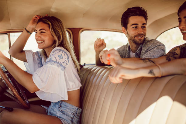 istock Friends going on a road trip in old car 967678284