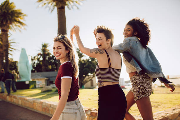 istock Female friends enjoying in a park 967678336