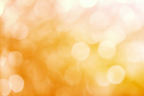 istock yellow abstract background with blurred defocus bokeh light 967682466