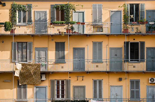 Symmetrical facade with shuttered windows and balconies in San Sebastian, Basque Country, Spain.