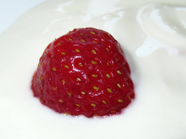 istock Ripe red strawberry in white cream 967697666