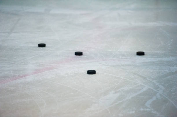 istock Hockey stick and puck 967701412