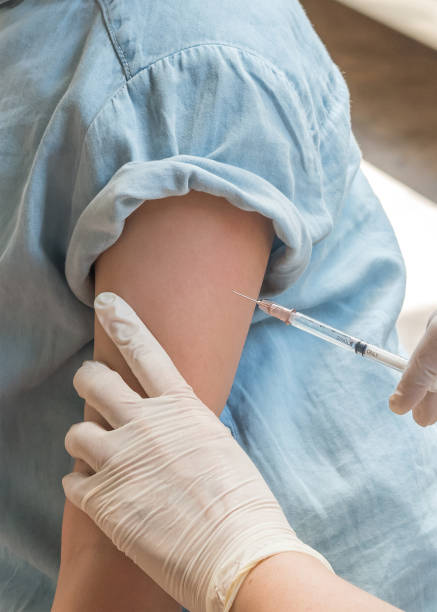 Immunization and vaccination for prevention for young child girl