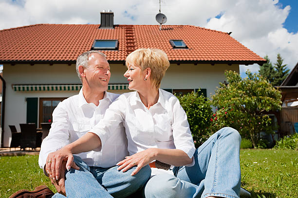 Senior couple sitting in their backyard during the daytime