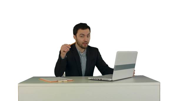 ハッピーに座っているビジネスマンオフィス」には、ノートパソコンとカメラに白背景で隔離 - looking at camera smiling desk isolated ストックフォトと画像