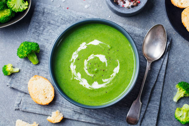 istock Broccoli cream soup in a bowl with toasted bread. Top view. Copy space. 967733036