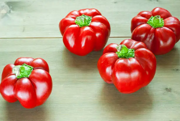 hungarian sweet peppers, wooden table background