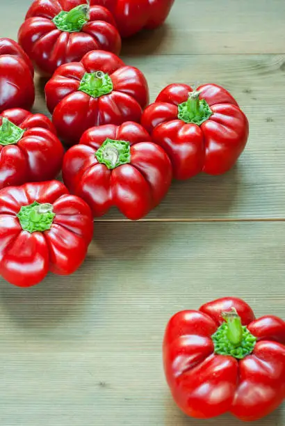 hungarian sweet peppers, wooden table background