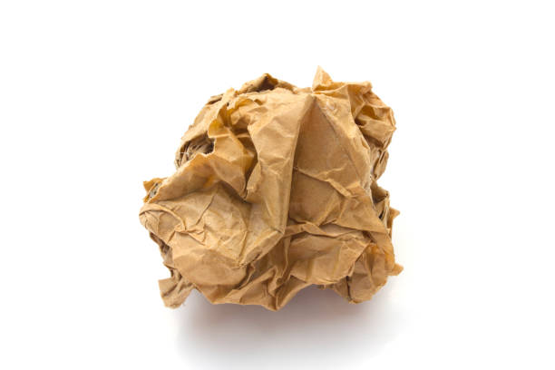 close-up of brown crumpled paper ball stock photo