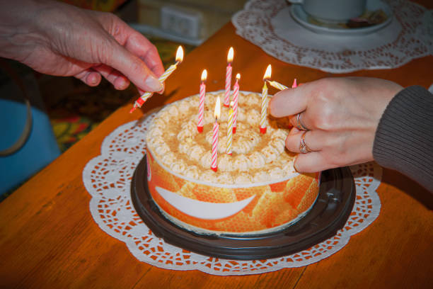 istock Female hands hold a festive cake 967773248