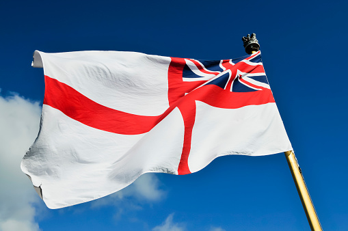 The White Ensign flies on the aft of a Royal Navy ship