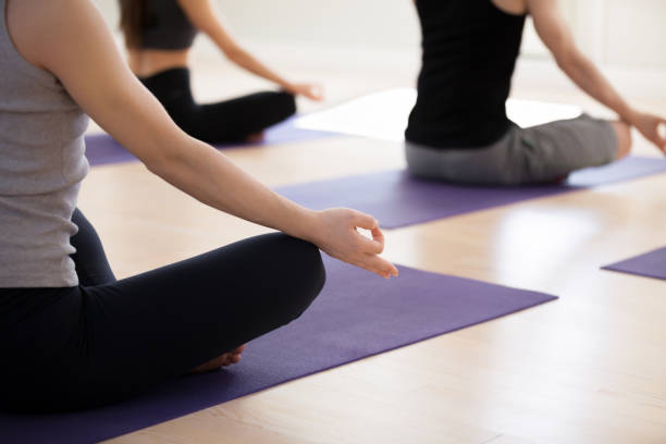 istock Sporty people in Easy Seat pose with mudra 967773956