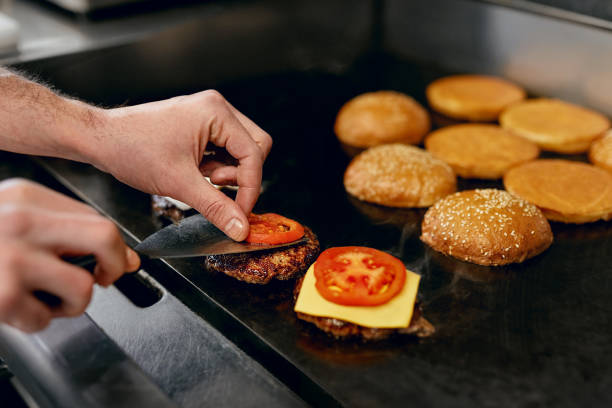 istock Cooking Burgers.  Meat And Buns Roasting On Grill 967774746