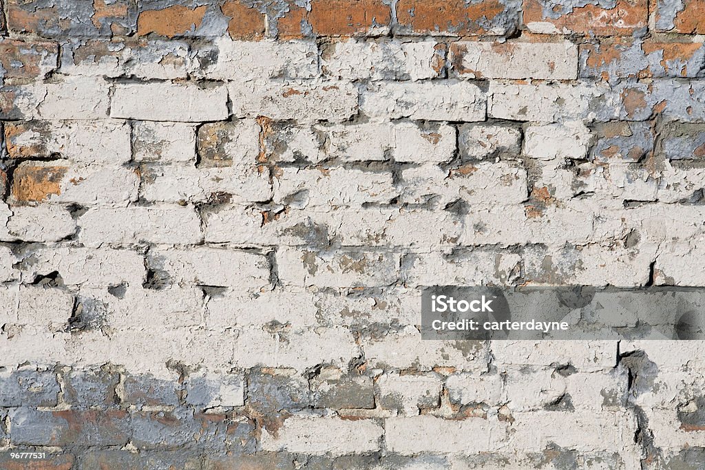 Old painted peeling brick wall; background  Abstract Stock Photo