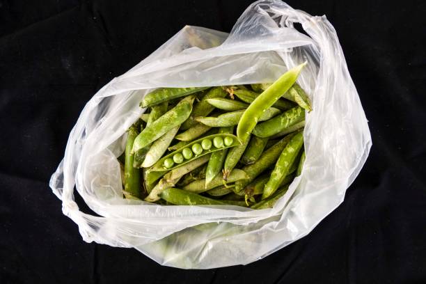 istock fresh shelled peas in a bag 967783872