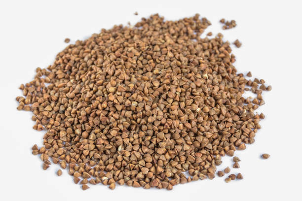 istock Heap of buckwheat isolated on white background. 967788172