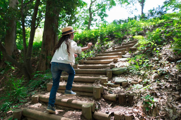 istock Girl playing in the forest 967788426