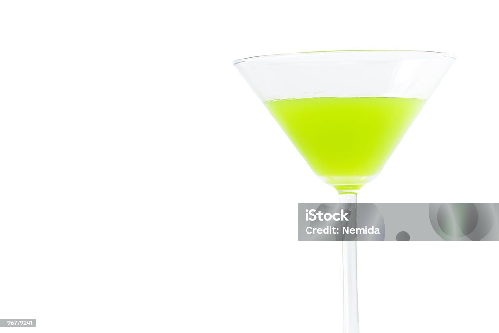 Lime green glass Green glass isolated on white background. Glass on left side by purpose. Apple Martini Stock Photo