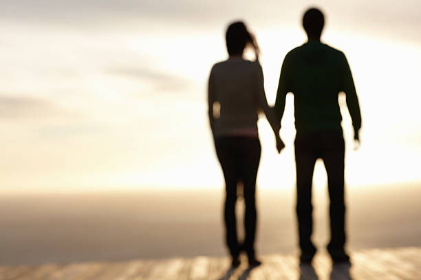istock Blurred image of couple enjoying sunset 96780923