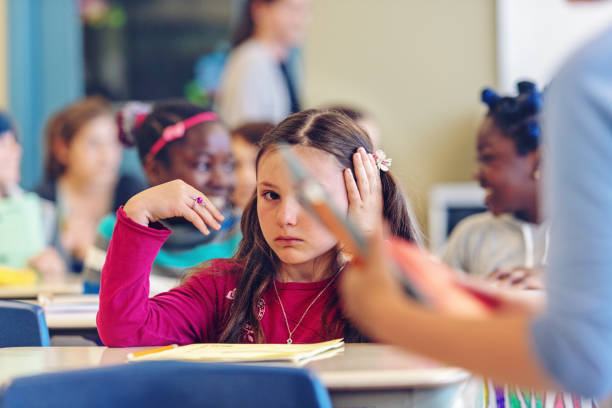 istock Sad schoolgirl in a classroom 967812078
