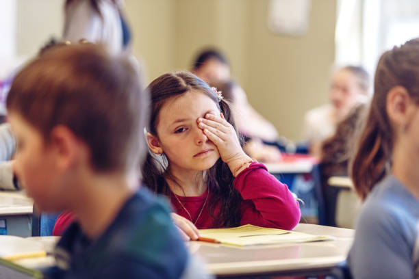 istock Sad schoolgirl in a classroom 967812094