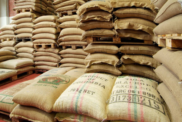 Milan, Italy - February 12, 2007: Stock burlap sacks full of coffee in warehouse