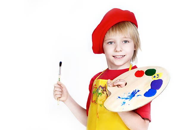 Little boy with brush and Artist's palette stock photo