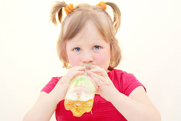 Drinking, girl, kid, bottle. stock photo