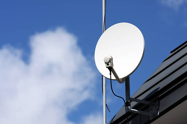 The silhouette of satellite dish and sky background