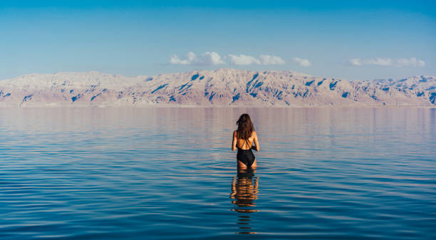 istock Young woman going to Dead Sea, Israel 967866030