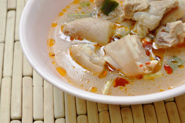 istock spicy boiled pork leg in Tom Yum soup 967866984