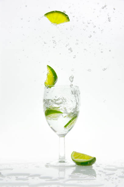 istock Lime pops from a glass with sparkling water 967871250