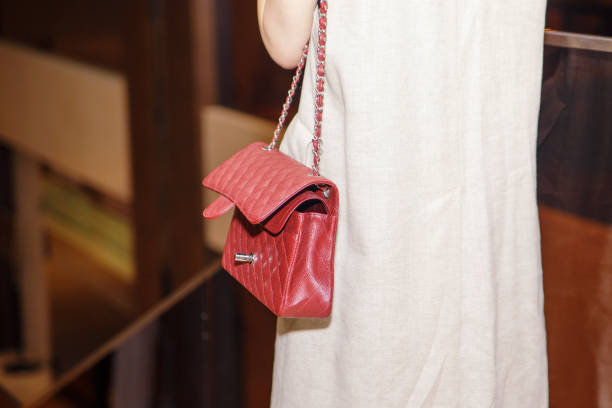 istock The woman is standing with her handbag open. 967883448