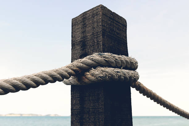 Nautical background rope covering an old wooden pole