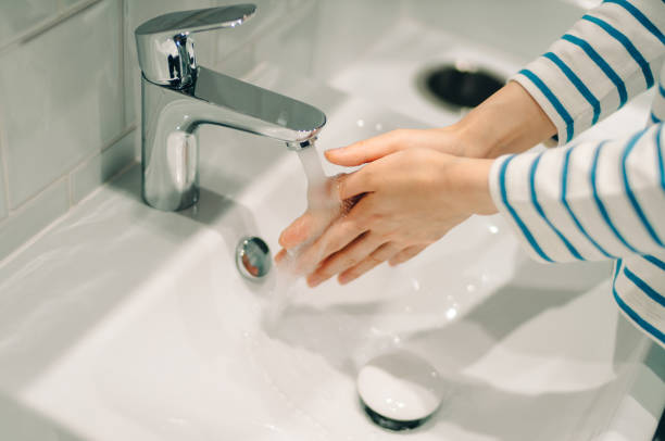 istock Young women washing her hands. 967890056